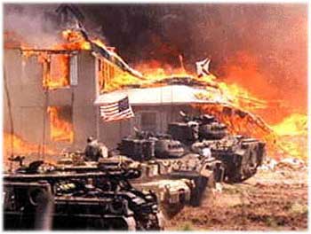 Mount Carmel Center on fire surrounded by U.S. Army tanks